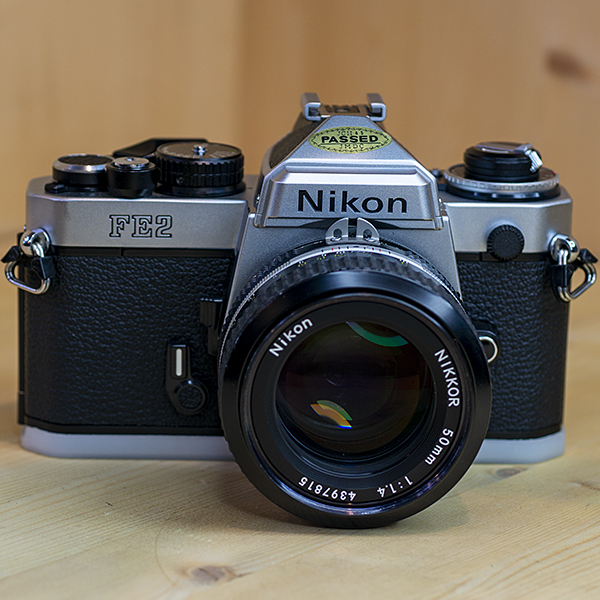 니콘 Nikon FE2 Body SLR Film Camera+MF NIKKOR50mmF1:1.4ai.스트렙.필타 97%